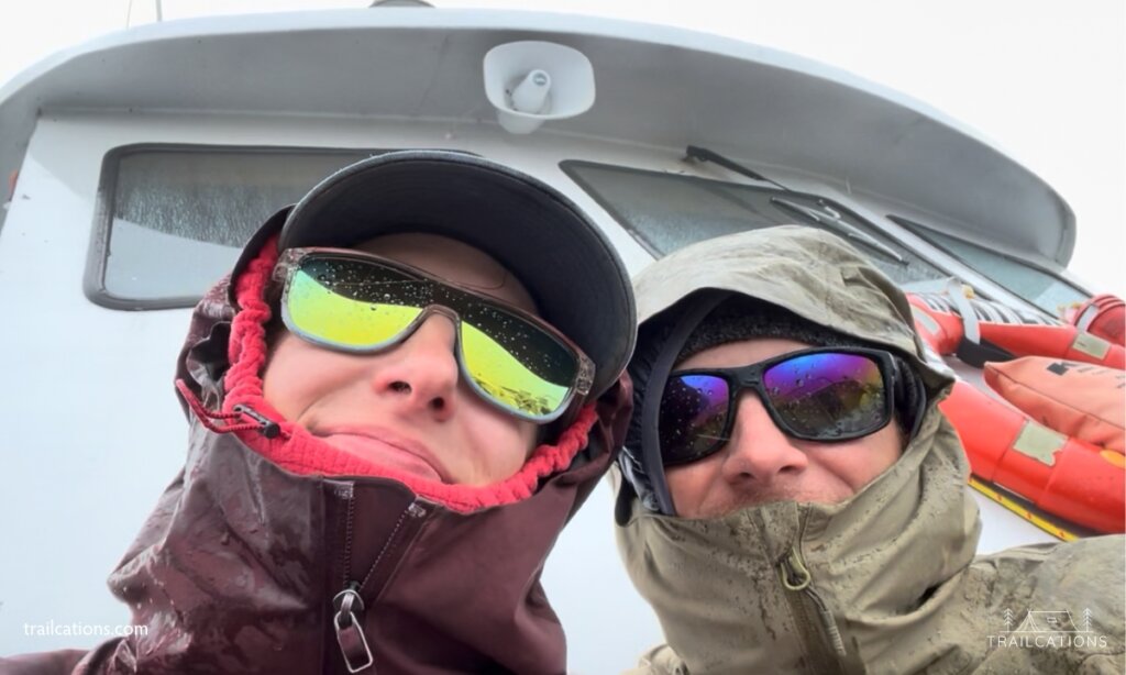 We cannot stress enough to wear warm and even waterproof clothes on the ferry. This is us a few days before the 4th of July getting snowed and sleeted on during the ferry ride back from Isle Royale.